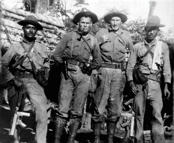 Puller (center left), Sergeant William "Ironman" Lee (center right), and two Nicaraguan soldiers in 1931