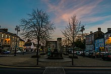 Newcastle West's main square, with Desmond Castle at centre. Desmond Castle, The Square, Newcastle West.jpg