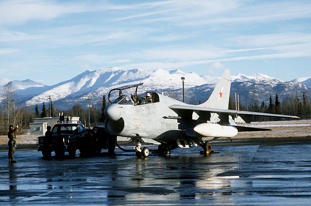 A US Navy Vought EA-7L Corsair II aircraft with a Soviet star and red numbers.