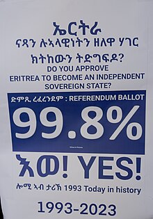 Commemorative poster in 2023, celebrating the anniversary of Eritrea's vote for independence. Eritrean independence anniversary sign, 2023.jpg
