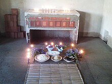 Offerings to the orixa Nana at an Umbandist centro Festanana cuco.jpg