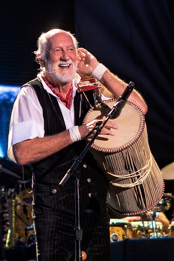 Fleetwood performing with Fleetwood Mac in 2018