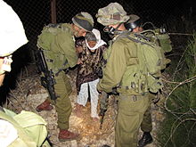 IDF soldiers rescued an eighty-year-old Lebanese woman, after she got tangled in the security fence on the northern border, on the Lebanese side Flickr - Israel Defense Forces - IDF Soldiers Rescue Lebanese Woman (1).jpg