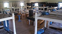 Many barracks contain large numbers of beds or bunk beds with minimal common areas Fort Larned Barracks.jpg