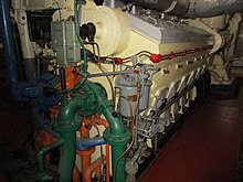 A GM EMD 12-567ATLP diesel engine as installed in USS LST-393, located in Muskegon, Michigan, July 2017. The engines were rated at 900 HP (each) at 744 RPM. GMLSTdieselengine.jpg