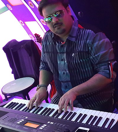 Goodly Rath While Composing in Studios G Rath with Instruments.jpg