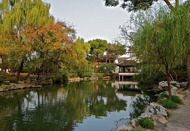 Naturalistic design of a Chinese garden incorporated into the landscape, including a pavilion