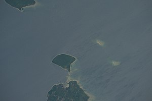 The Rock Island passage, taken on June 20, 2016 from the International Space Station. St. Martin Island in Michigan is at the top. Rock Island and the much smaller Fish Island and Fisherman's Shoal below are in Wisconsin. These islands were the source of dispute during the U.S. Supreme Court cases Wisconsin v. Michigan, 295 U.S. 455 (1935) and Wisconsin v. Michigan, 297 U.S. 547 (1936). ISS048-E-3055 - View of Earth.jpg