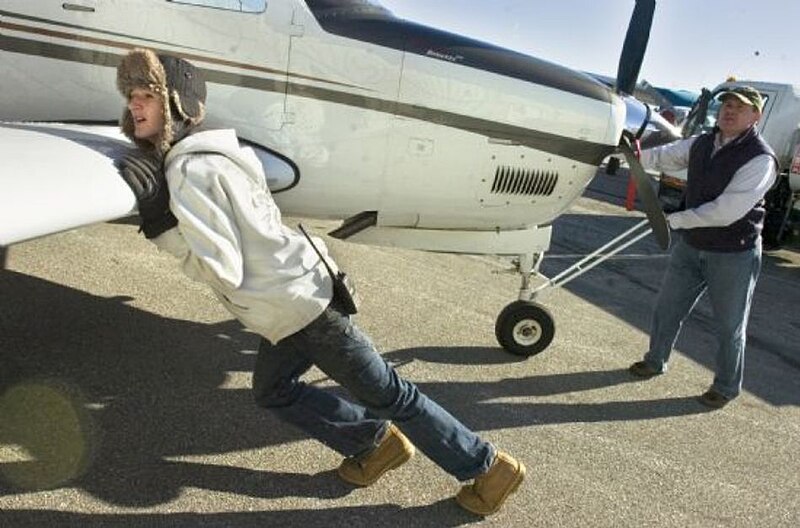 File:James sullivan pushing plane.jpg