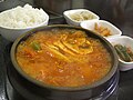 Kimchi-jjigae still boiling in ttukbaegi