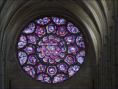 Rose window A circular window especially used in Gothic churches and divided into segments by stone mullions and tracery More images...