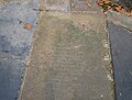 Ledger stones outside St. Augustine's Tower in Hackney Central.