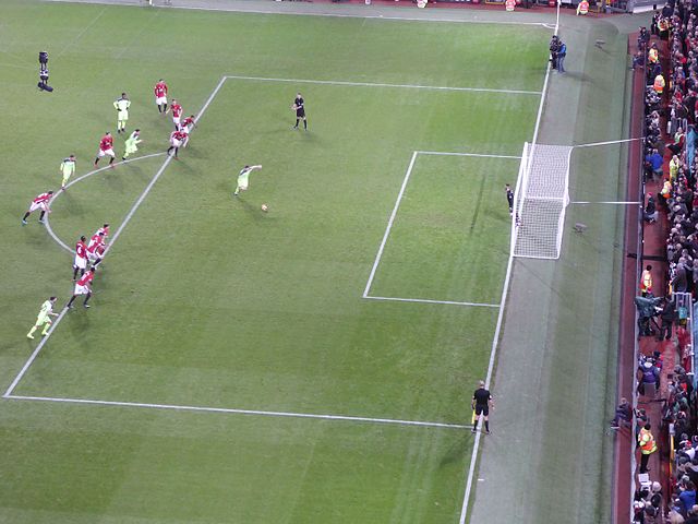 James Milner scores a penalty kick to give Liverpool the lead at Old Trafford; the final score was 1–1.