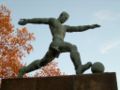 Sculpture of a football player near the stadium