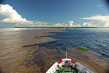 The natural phenomenon of the confluence of the Rio Negro's water and the Solimões River's water