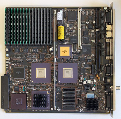Motherboard of a NeXTcube computer (1990). The two large integrated circuits below the middle of the image are the DMA controller (l.) and - unusual -