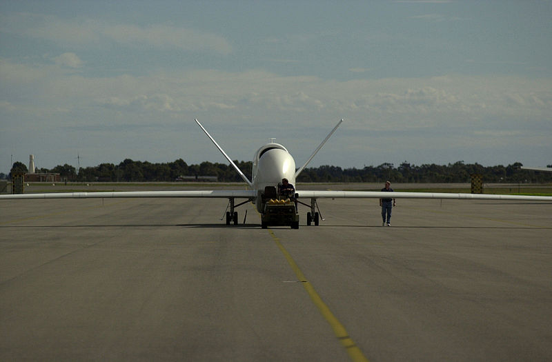 File:Northrop Grumman contractors tow in the Global Hawk aircraft after working on its sensors at Edinburgh Air Force Base, Adelaide, Australia, May 13, 2001, in support of Exercise Tandem Thrust 010513-F-JQ435-013.jpg