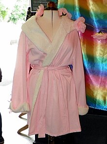 Pink dressing gown costume from EastEnders, said to belong to Linda Carter (Kellie Bright) but usually worn by Mick, including for their wedding, on display at the EastEnders Meet and Greet event. Pink dressing gown EastEnders.jpg