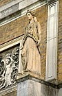 One of the four Coade stone caryatids atop the columns of the east front, after those that enclose the sanctuary of Pandrosus, Athens.