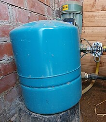 A diaphram type pressurizer on a domestic rainwater system, with the pump and Square D pressure switch in the background Pressure tank and square D.jpg