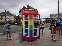 A KCOM K6 telephone box in Pride colours in Kingston upon Hull during Pride in Hull 2022.