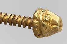 Roman lion's head gold screw fastener for solid gold medallion bracelet c. 400 AD. Roman Solid Gold Medallion Bracelet Screw (cropped).jpg