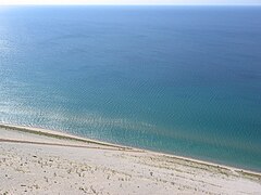 View from Lake Michigan Overlook, with people climbing up the dunes