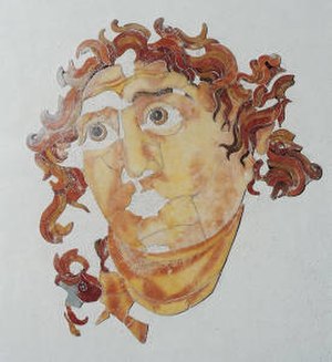 Head of Helios depicted in polychrome marble inlays, located in the Santa Prisca Mithraeum.