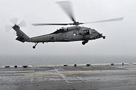 U.S. Navy helicopter landing on a ship after Sewol rescue operation.jpg