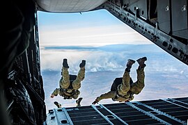 U.S. and Australian special operations forces in high-altitude low-opening parachute jump.jpg