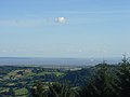 View from Twmbarlwm over the Bristol Channel towards England. Brean Down is in the centre of the photo. Weston-super-Mare is out of sight in the bay to the left of Brean Down.