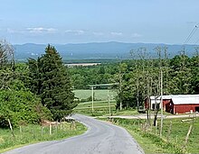 View from Argyle's Street Road looking WNW at the Hudson Valley and the nearby Adirondack Mountains. View of Hudson Valley and Adirondack Mountains from Street Road in Argyle.jpg