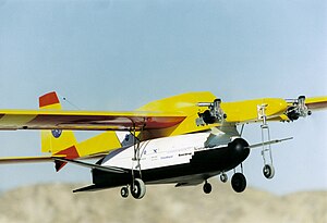 This radio-controlled airplane is carrying a scale model of Lockheed Martin X-33 and is taking part in NASA research. X-33 air drop model.jpg