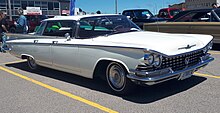 1959 Buick LeSabre with characteristic beltline surrounding the exterior 1959 Buick LeSabre Four-Door Hardtop in Arctic White, Front Right, 06-15-2019.jpg