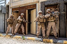 US Marines breach a door using a sledgehammer 2-1 Conducts Mechanical Breaching Image 7 of 8 6656546 210512-M-CH865-1003.jpg