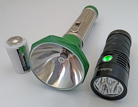 Left to right: 3x AA to D parallel battery converter with rechargeable NiMH AA-size batteries inserted. MY DAY vintage flashlight. It uses 1.5 V D-size batteries. Sofirn SP36 flashlight.  It features a 5 V 2 A USB-C charging port to load 3.7 V 18650 rechargeable lithium-ion batteries.