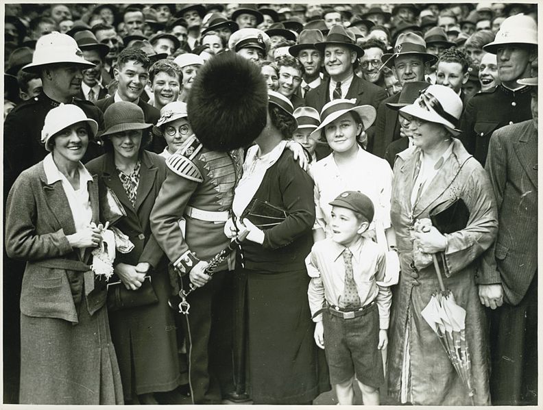 File:A member of the Band of His Majesty's Grenadier Guards kissing a person in crowd in Martin Place, Sydney after a ceremony at the Cenotaph, 8 November 1934 (8447101008).jpg