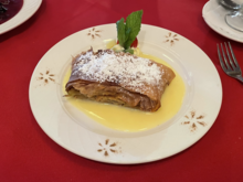 Apple strudel (German: Apfelstrudel
), a traditional Austrian and Bavarian dessert, served with powdered sugar on top and vanilla sauce underneath Apple Strudel.png