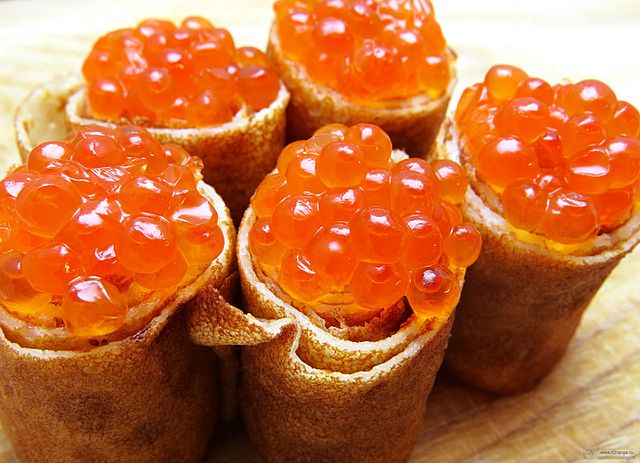 Blini served with red caviar
