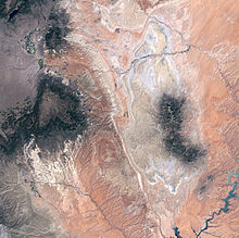 The Fremont River crosses the Waterpocket Fold in the upper half of this satellite picture, while the white line of Capitol Reef bisects the lower half. Capital Reef satellite image.jpg