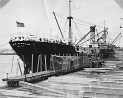 Cargo ship WEST HENSHAW at dock being loaded with lumber, Bloedel-Donovan Lumber Mills, ca 1922-1923 (INDOCC 1115).jpg