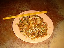 A plate of Penang char kway teow. The dish, one of the more popular street dishes in the state, is available in most hawker stalls all over Penang. Char Kway Teow, Georgetown, Penang, Malaysia.JPG