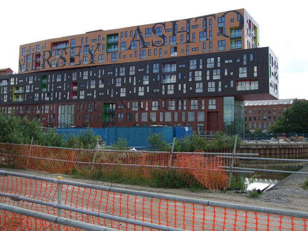 Will Alsop's apartment block at New Islington, Manchester (2009), is situated alongside the Ashton Canal, and the facades feature the names of local w