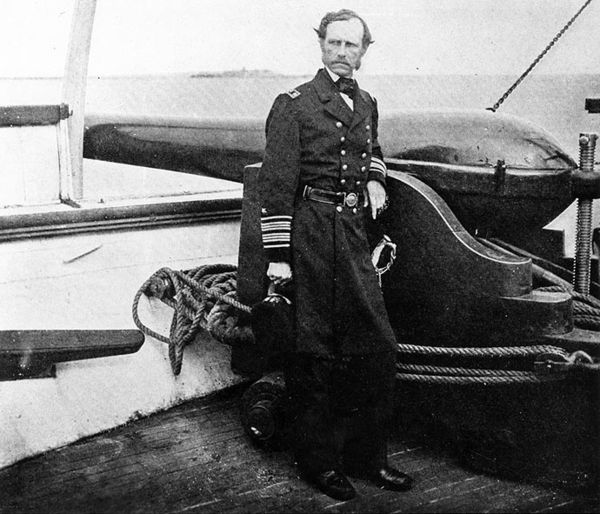 Rear Admiral John A. Dahlgren, on board the Pawnee, beside a 50-pounder Dahlgren rifle.