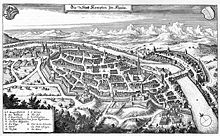 A finely detailed drawing of an old city, with church towers, thick defensive walls, moats, and many houses. The Iller river divided the Free Imperial City of Kempten and Kempten Abbey. De Merian Sueviae 144.jpg