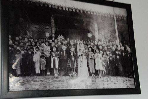 Muslim General Ma Jiyuan's wedding with a Kuomintang flag in the background.