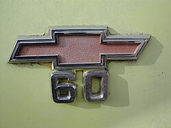 Detail of the "60" emblem on the fender of the truck.