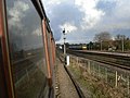 British Rail Class 150 passes on the parallel main line at Kidderminster.