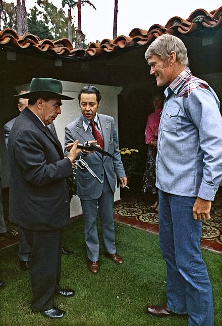 General Secretary of the Soviet Communist Party Leonid Brezhnev (left) and interpreter Viktor Sukhodrev meet Chuck Connors, 1973