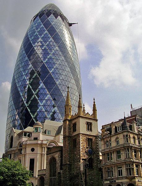 Norman Foster's 'Gherkin' (2004) rises above the sixteenth century St Andrew Undershaft in the City of London